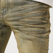Close-up of beige jeans on a white background