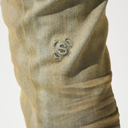 Close-up of a beige fabric with a logo on a white background