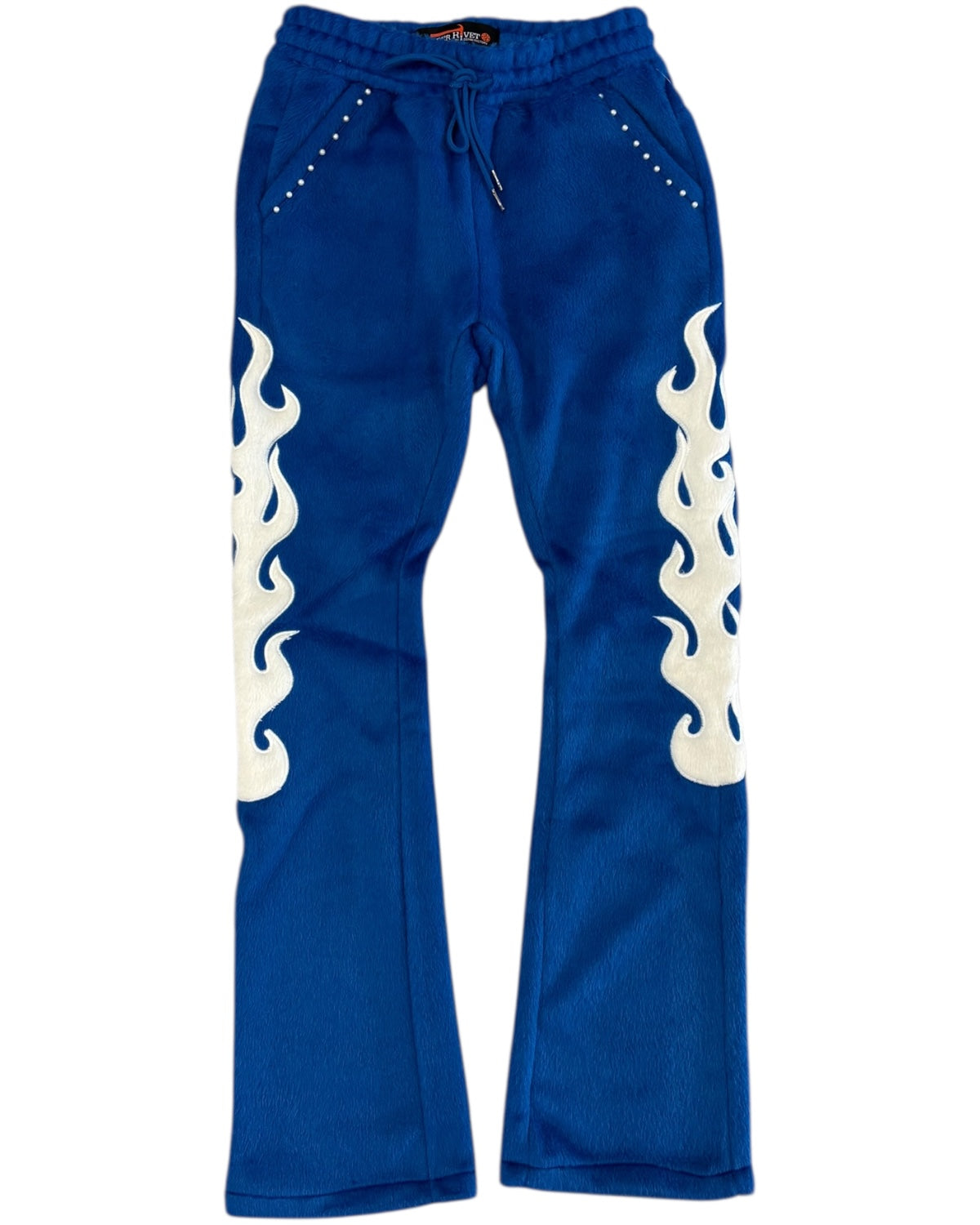 Blue sweatpants with white flame designs on a white background