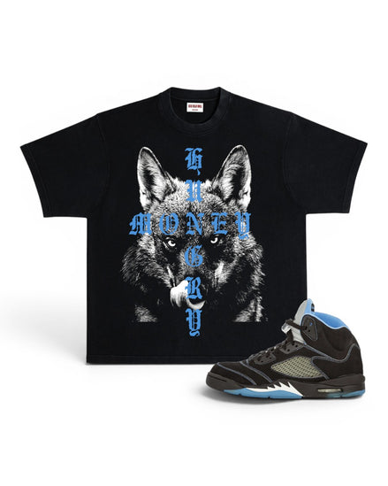 A black graphic t-shirt featuring a wolf design with blue gothic text reading 'MONEY HUNGRY', displayed next to a black and blue high-top sneaker on a white background.