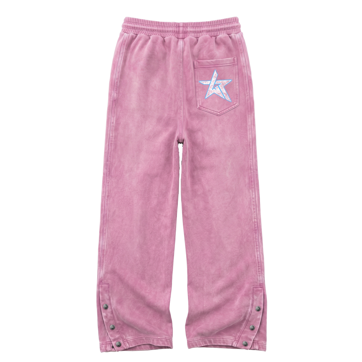 Pink corduroy pants with an elastic waistband, a back pocket featuring a white embroidered star with a blue outline, and snap-button details on the lower legs.