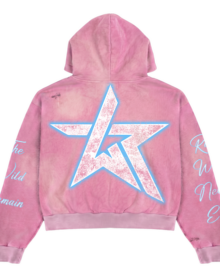 A pink acid-wash hoodie shown from the back, featuring a large distressed white star graphic outlined in light blue on the back, with white script text printed on both sleeves.
