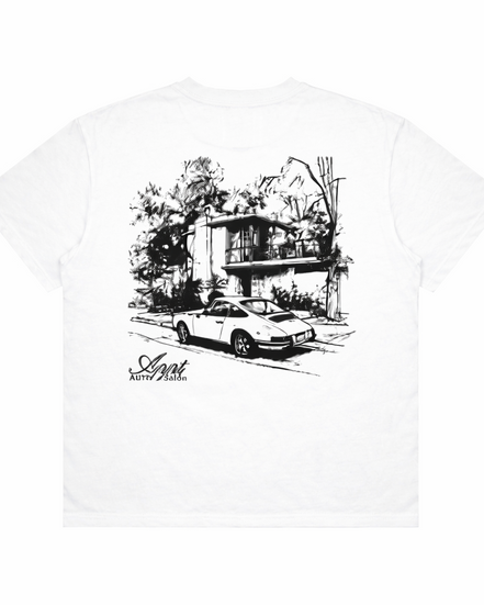 White t-shirt with black graphic of a car and house, brand 'Appt' visible.