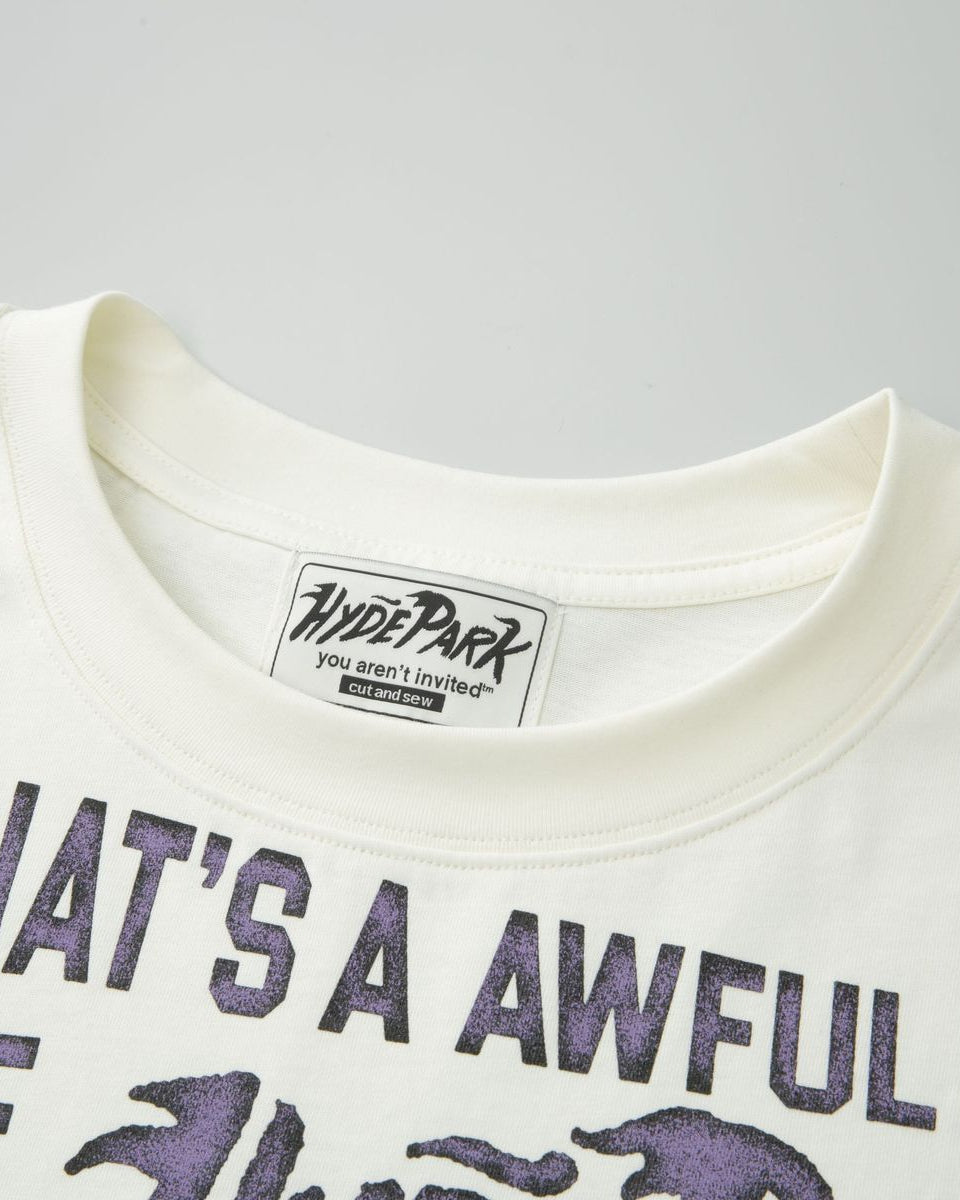 White t-shirt with purple text and Hyde Park label on a gray background
