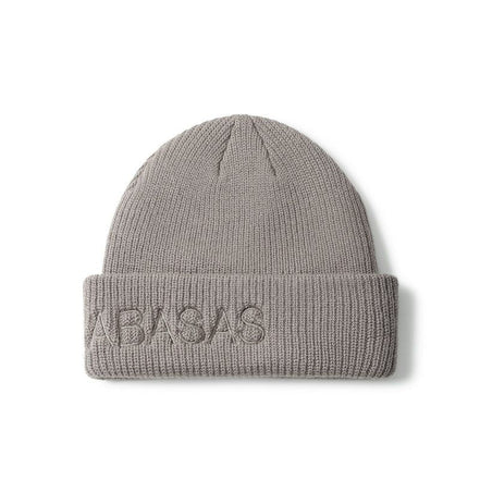 Beige knit beanie with 'VALABASAS' embroidery on a white background