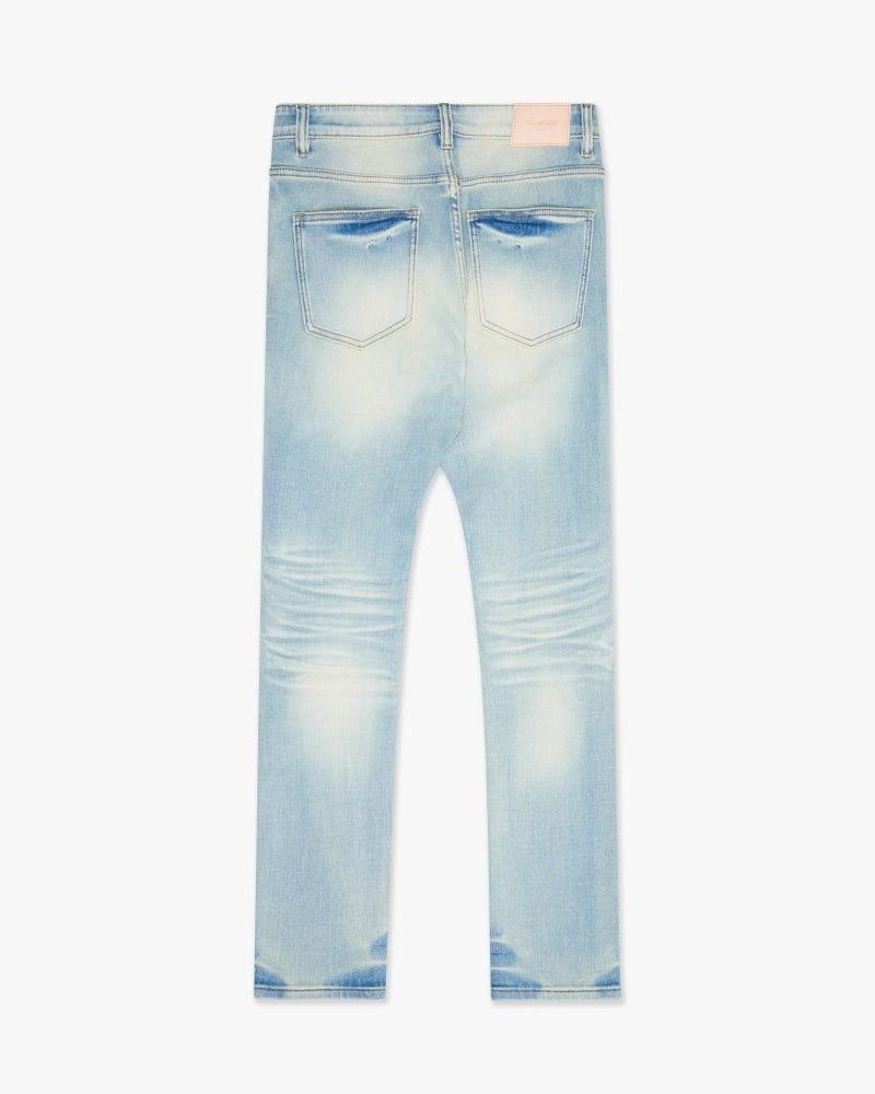 Light blue distressed jeans on a white background