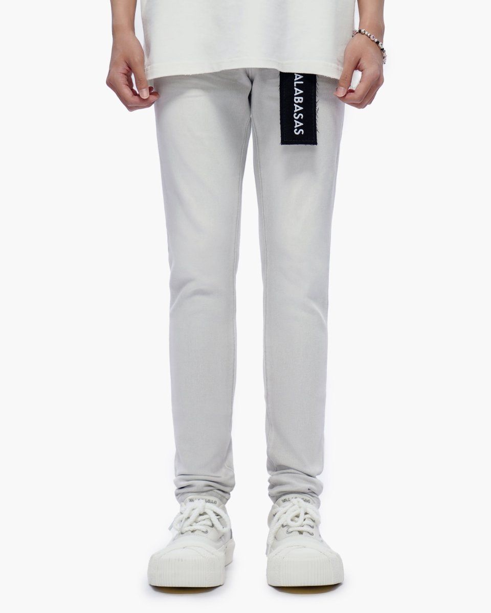 Light gray jeans with a brand label on a white background
