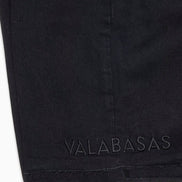 Black fabric with 'VALABASAS' branding on a white background