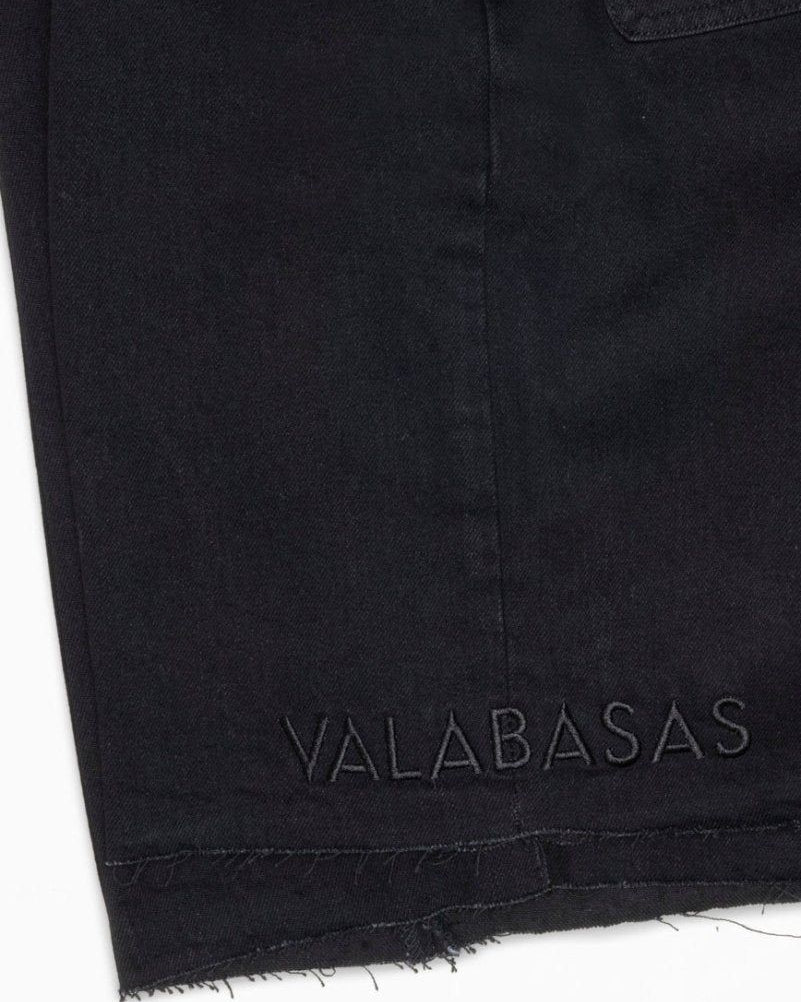 Black fabric with 'VALABASAS' branding on a white background
