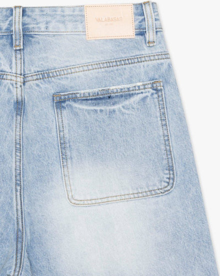 Light blue denim shorts with a brand label on a white background