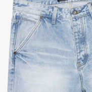Light blue denim jeans with a brand label on a white background