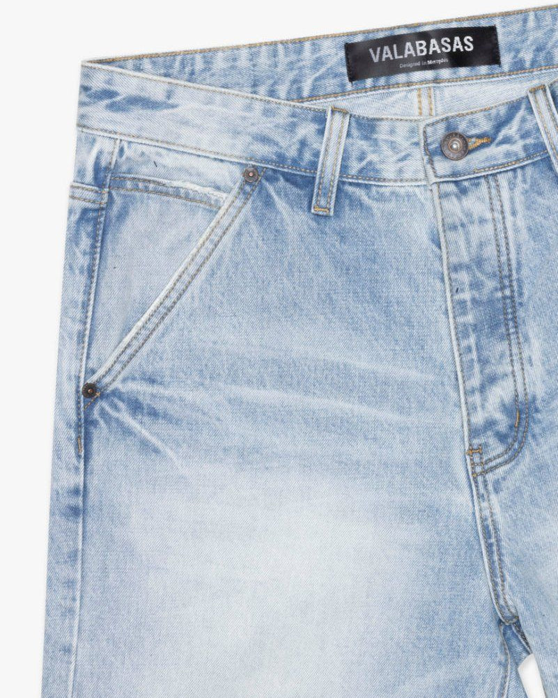 Light blue denim jeans with a brand label on a white background