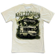 An off-white short-sleeve t-shirt with a large graphic print on the back featuring a vintage food truck under a 'Meltdown Hollywood' sign.