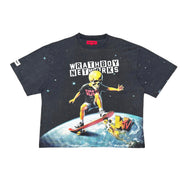 A black short-sleeve graphic t-shirt featuring a cartoon astronaut riding a skateboard on Earth from space, with the text 'WRATHBOY NETWORKS' printed above the graphic.