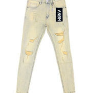 Light wash distressed skinny jeans with ripped details on the thighs and knees, featuring a black ANGM brand tag on the pocket.