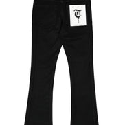 Black pants with a white label featuring a logo on a white background
