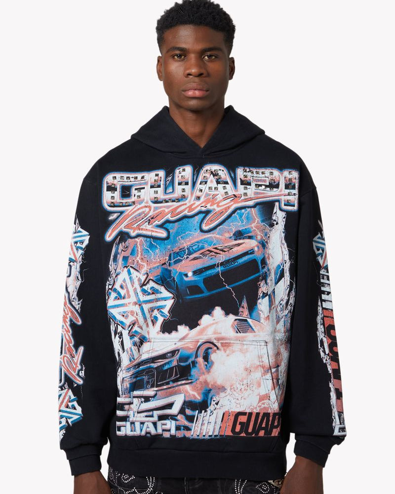 Person wearing a black hoodie with colorful graphics and text on a white background