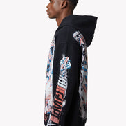 Person wearing a black hoodie with colorful graphic designs on a white background