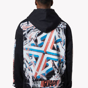 Person wearing a black hoodie with colorful geometric pattern on the back against a white background