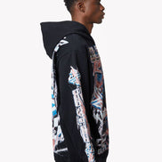 Person wearing a black hoodie with colorful graphics on a white background