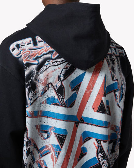 Person wearing a black hoodie with a colorful geometric pattern on the back