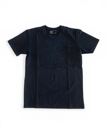 Black t-shirt with a small design on a white background