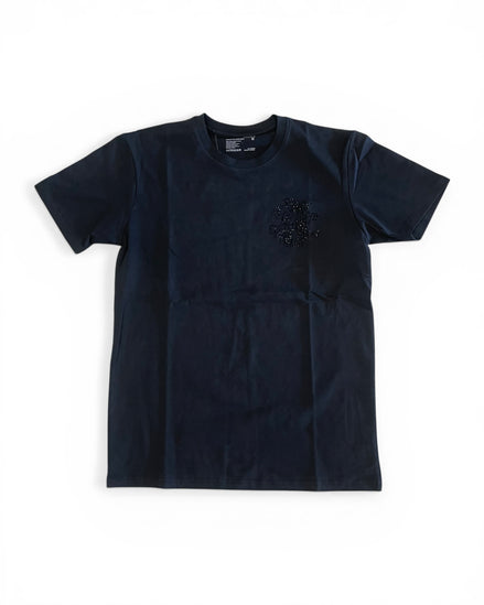 Black t-shirt with a small design on a white background