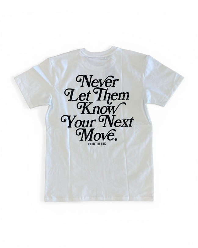 White t-shirt with black text 'Never Let Them Know Your Next Move' on a white background