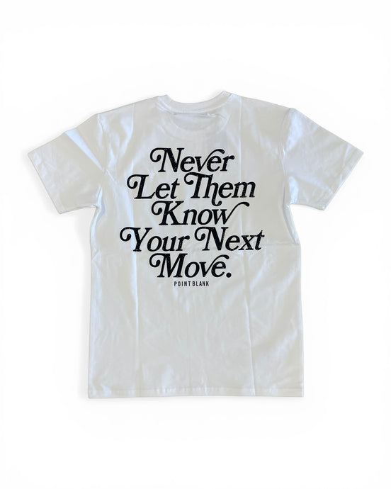 White t-shirt with black text 'Never Let Them Know Your Next Move' on a white background