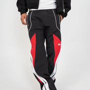 Black and red tracksuit with white accents on a plain background