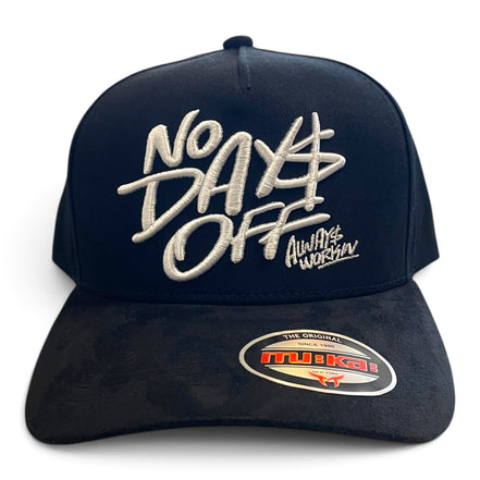 A black trucker-style cap with white embroidered text reading 'No Days Off' and 'Always Workin' on the front, plus a visible Mikai sticker on the brim, shown on a plain white background.