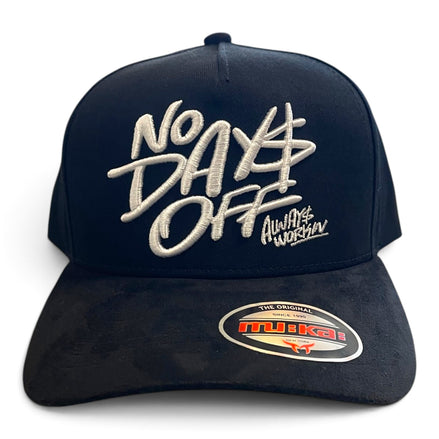 A black trucker-style cap with white embroidered text reading 'No Days Off' and 'Always Workin' on the front, plus a visible Mikai sticker on the brim, shown on a plain white background.