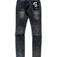 A pair of dark blue denim jeans with a faded wash, featuring a white embroidered 'R' logo patch on the back right pocket and a small white brand tag at the back waistband, shown against a plain white background.