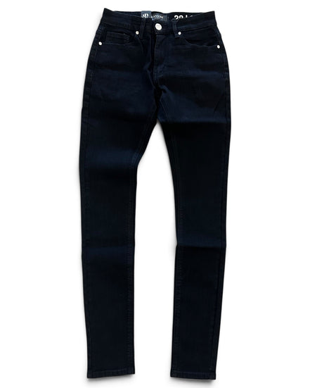 A pair of dark navy blue skinny jeans laid flat against a white background.