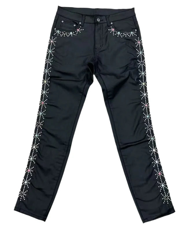 Black pants with decorative elements on a white background