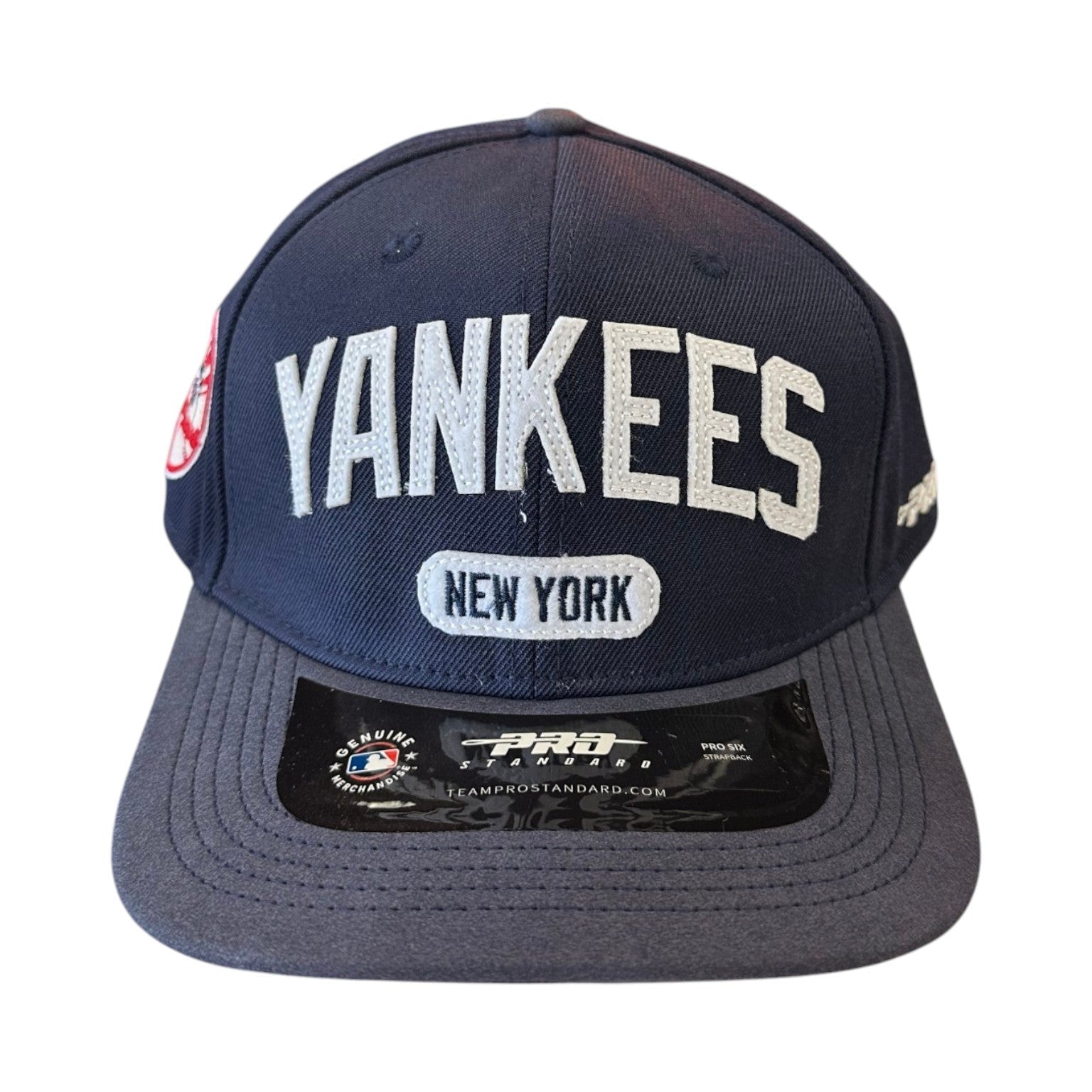 Navy blue cap with 'Yankees' and 'New York' text on a white background