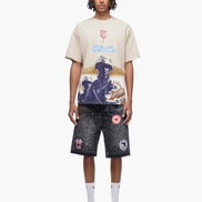 Person wearing a graphic t-shirt and shorts on a white background