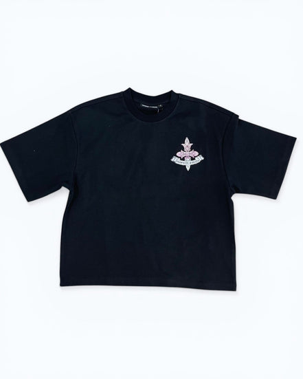 Black t-shirt with a small white logo on a white background