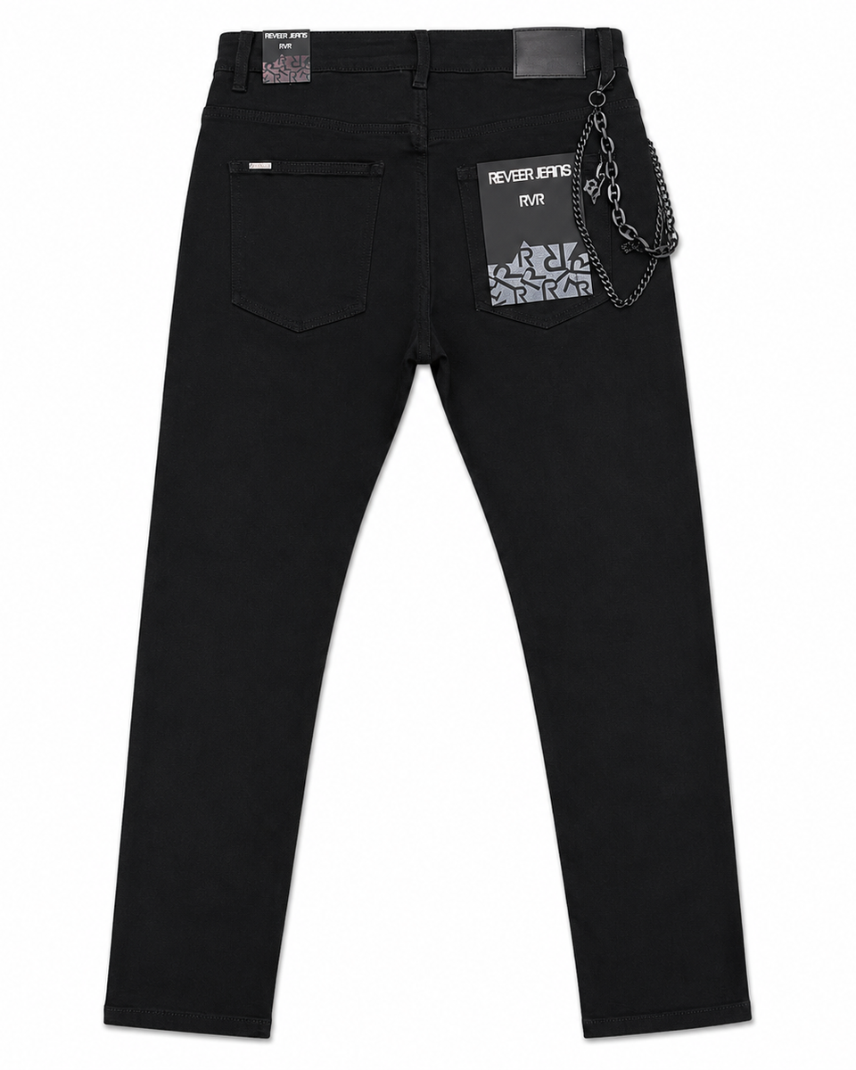 Black denim jeans shown from the back, featuring a pocket with a chain accessory hanging from the waistband and a hangtag that reads 'REVIVAL DENIM 508'.