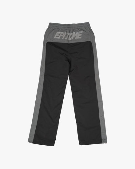 Black and gray pants with 'Exo' branding on a white background