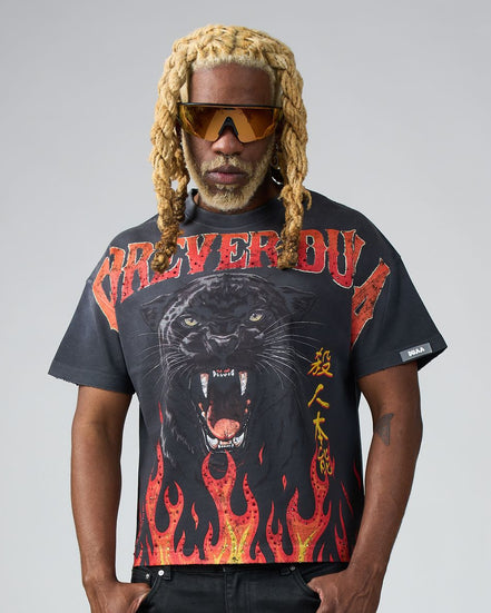 Person wearing a black t-shirt with a panther graphic and text on a gray background