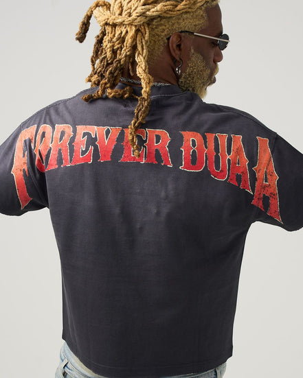 Person wearing a black shirt with 'FOREVER DUAA' printed on the back against a gray background