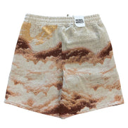 Shorts with a mountain landscape print on a white background
