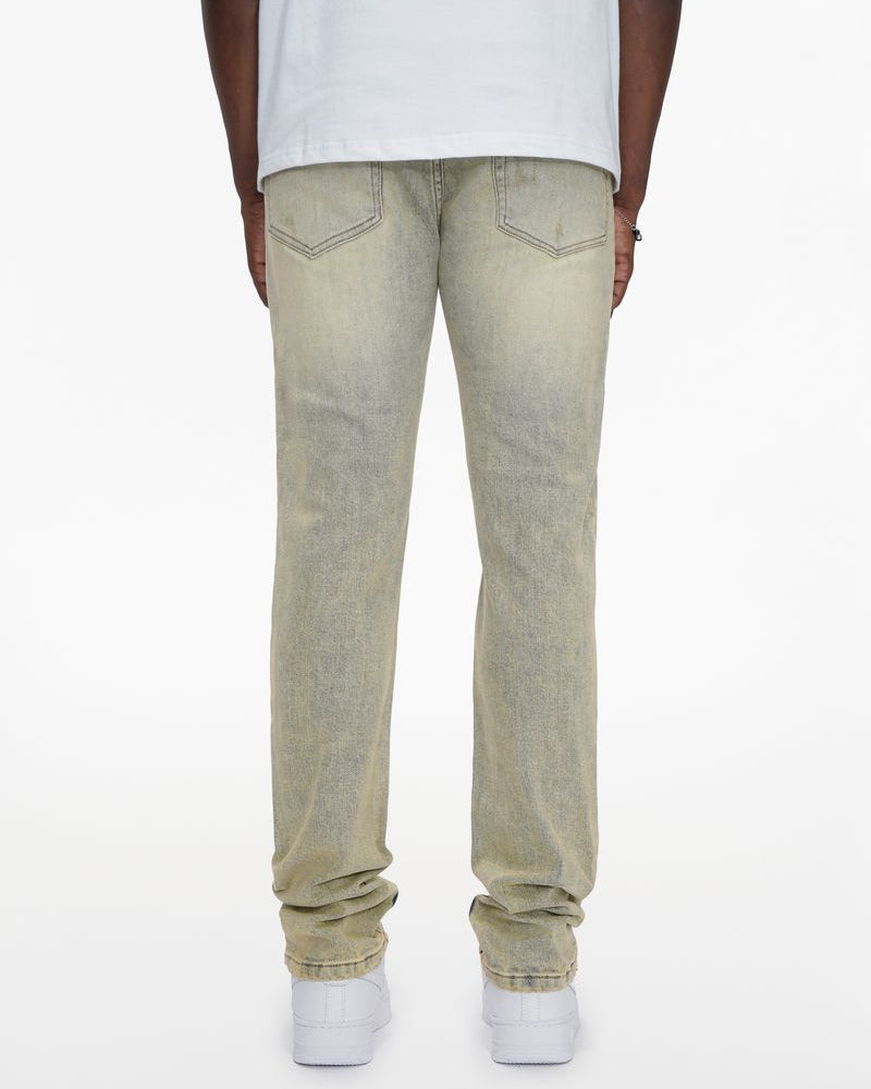 Person wearing light-colored jeans on a white background