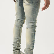 Light blue jeans worn by a person on a white background