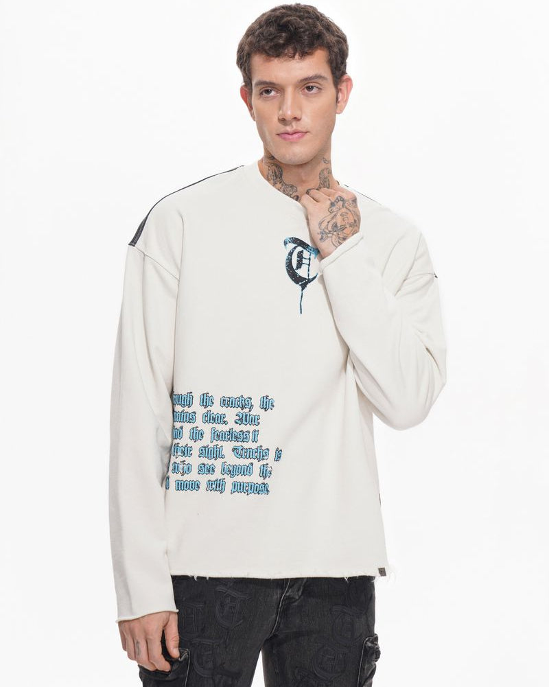 Man wearing a white sweatshirt with text and graphics on a white background