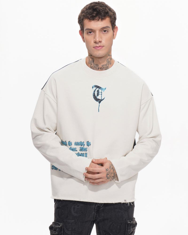 Man wearing a white sweatshirt with text and graphics on a white background