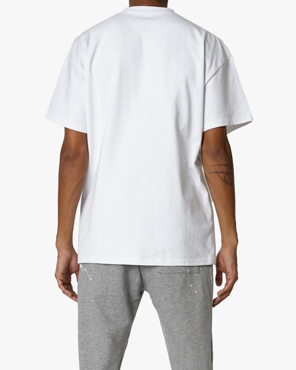 Person wearing a plain white t-shirt and gray pants on a white background