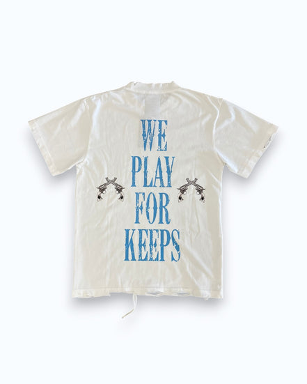 White shirt with blue text 'WE PLAY FOR KEEPS' on a white background