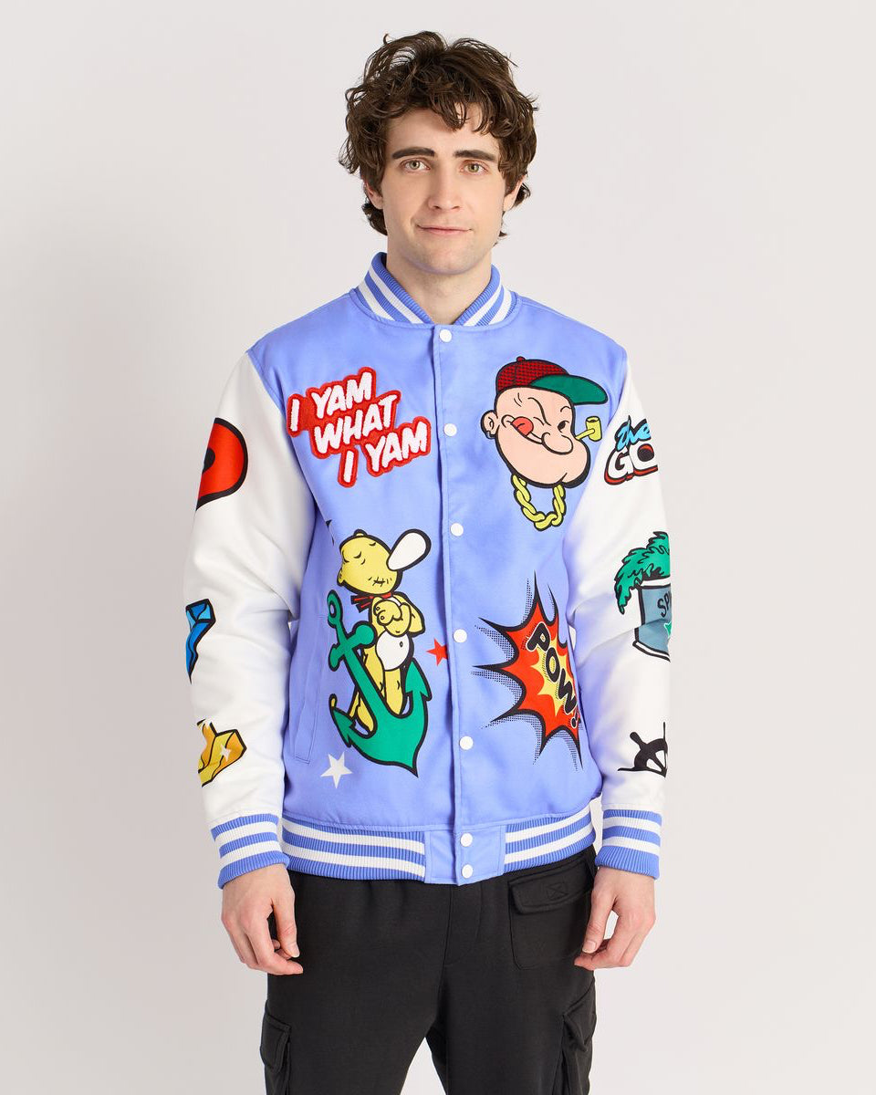 Person wearing a colorful cartoon-themed jacket with various graphics on a plain background